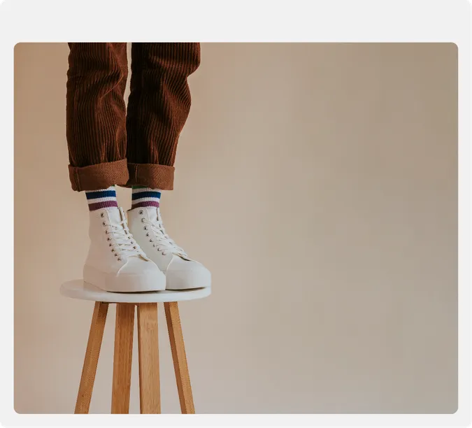 An advertisement image of white sneakers